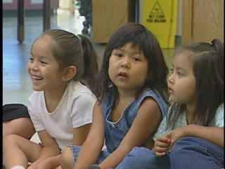 Head Start girls listening to stories